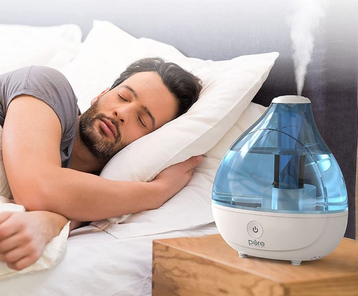 Men Sleeping Next to Humidifier