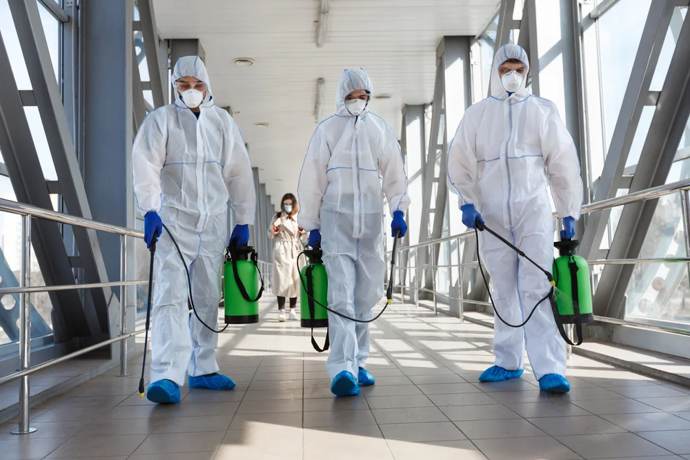 a group of people in hazmat suits with sprayers / Complete Commercial Mold Remediation Guide for 2025 / What Is Commercial Mold Remediation? / Why Is Commercial Mold Remediation Important? / Step-by-Step Mold Remediation Process / Common Types of Mold Found in Commercial Buildings / Signs You Might Have a Mold Problem / How to Test for Mold in Commercial Buildings / Factors That Affect Mold Remediation Costs / Why Hire Professional Mold Remediation Services / Best Practices for Preventing Mold Recurrence / Conclusion: Protecting Your Property and Health / ETA Mold Inspection in Florida