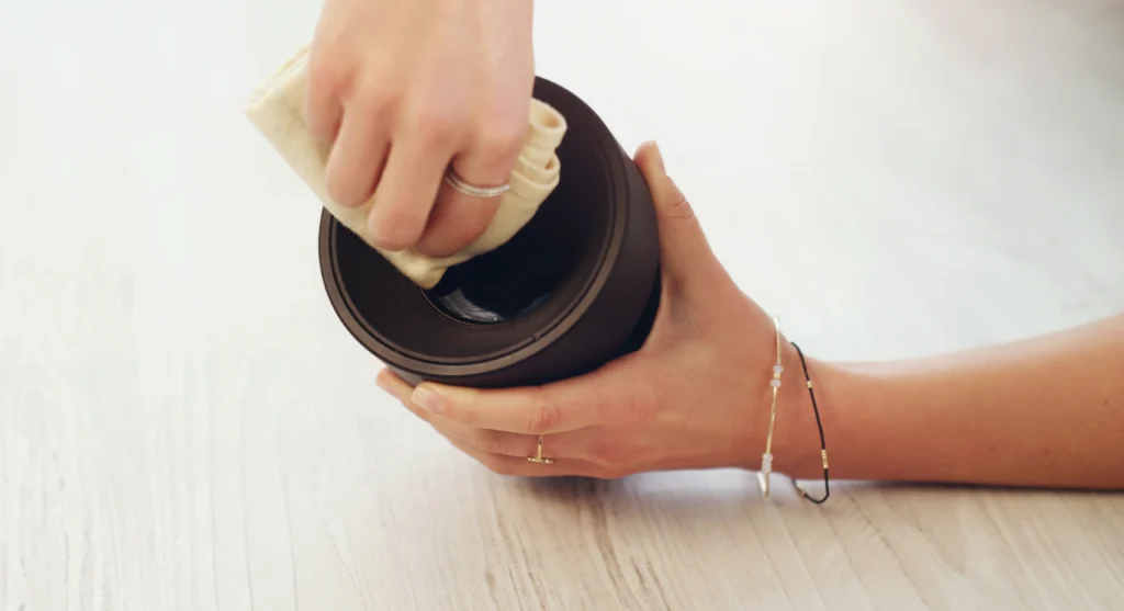 How to Remove Mold from Koozie? A Complete Guide 2 A man cleaning koozie with a cloth.