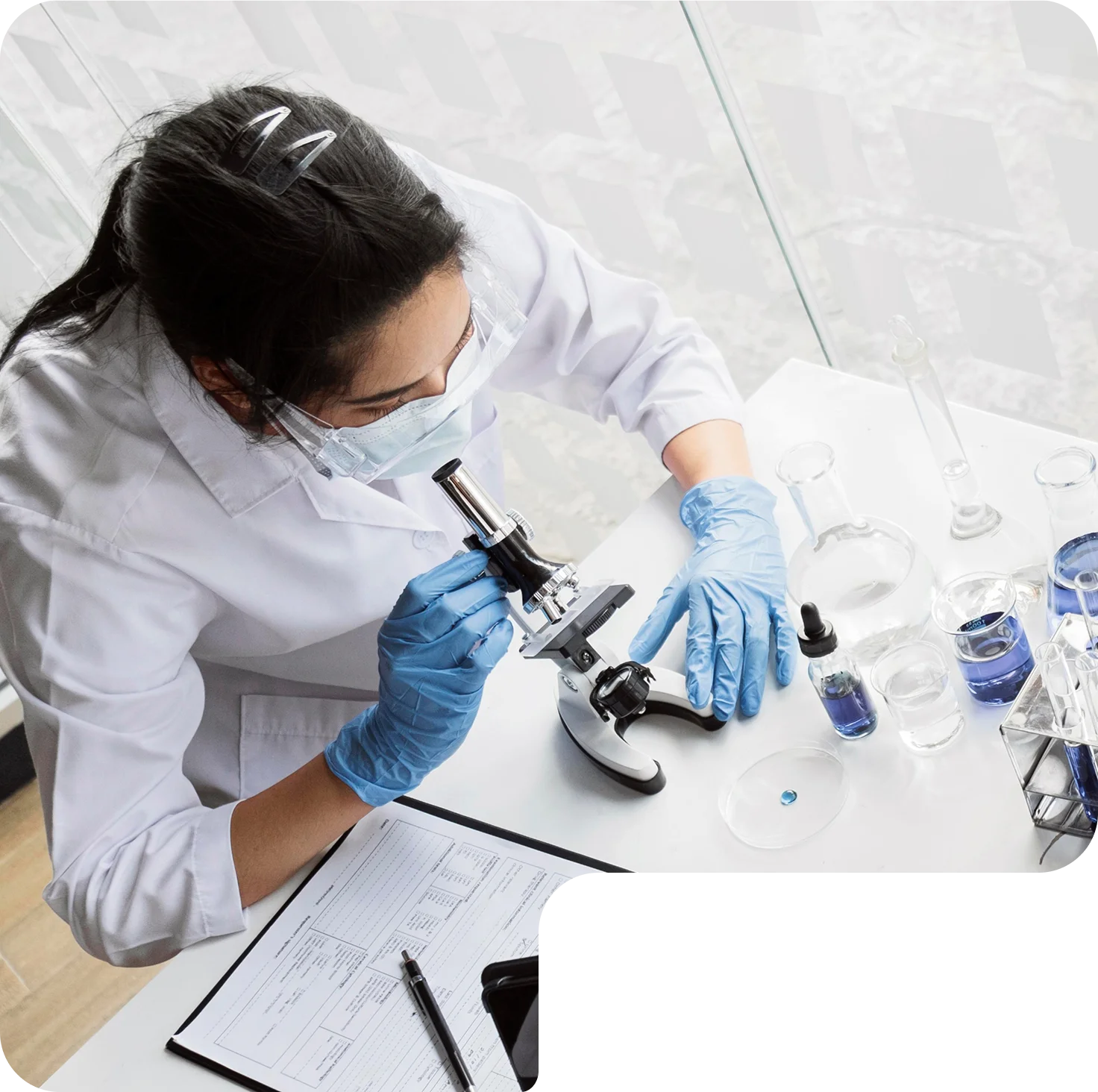 Scientist working with a microscope in a laboratory